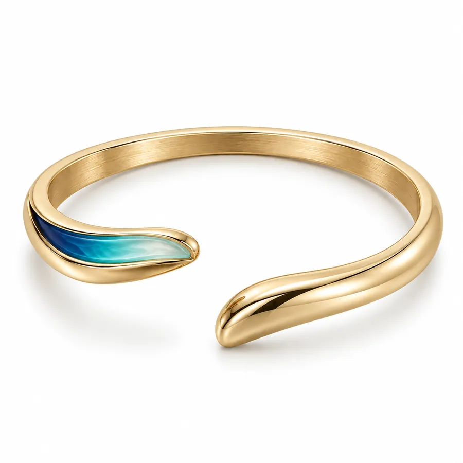Concept de jonc ouvert doré avec détail bleu-vert à une extrémité
