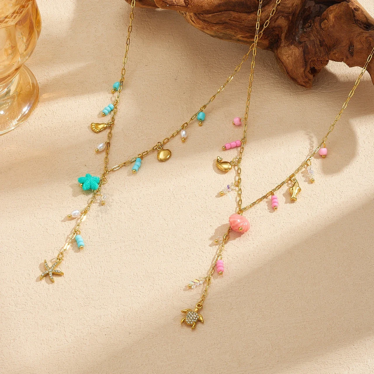 Y-ketting met bedels van zeeschildpad en schelp, verguld productfoto