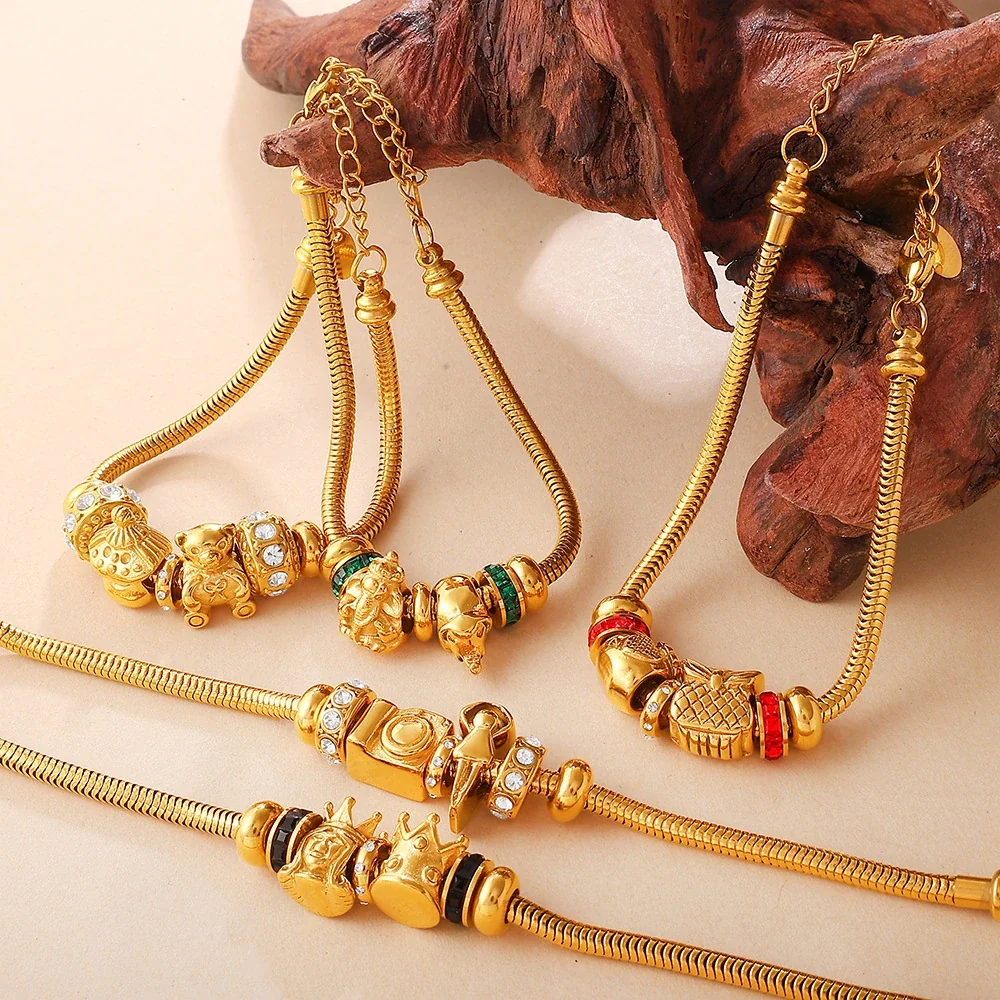 Charm Bracelet with Snake Chain and Animal Motifs, Gold-Plated