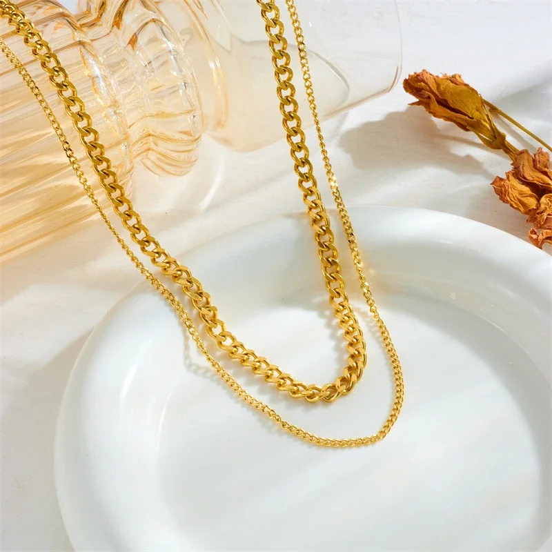 Sieradenset met dubbellaagse Cubaanse en gourmetschakelketting van verguld staal productfoto