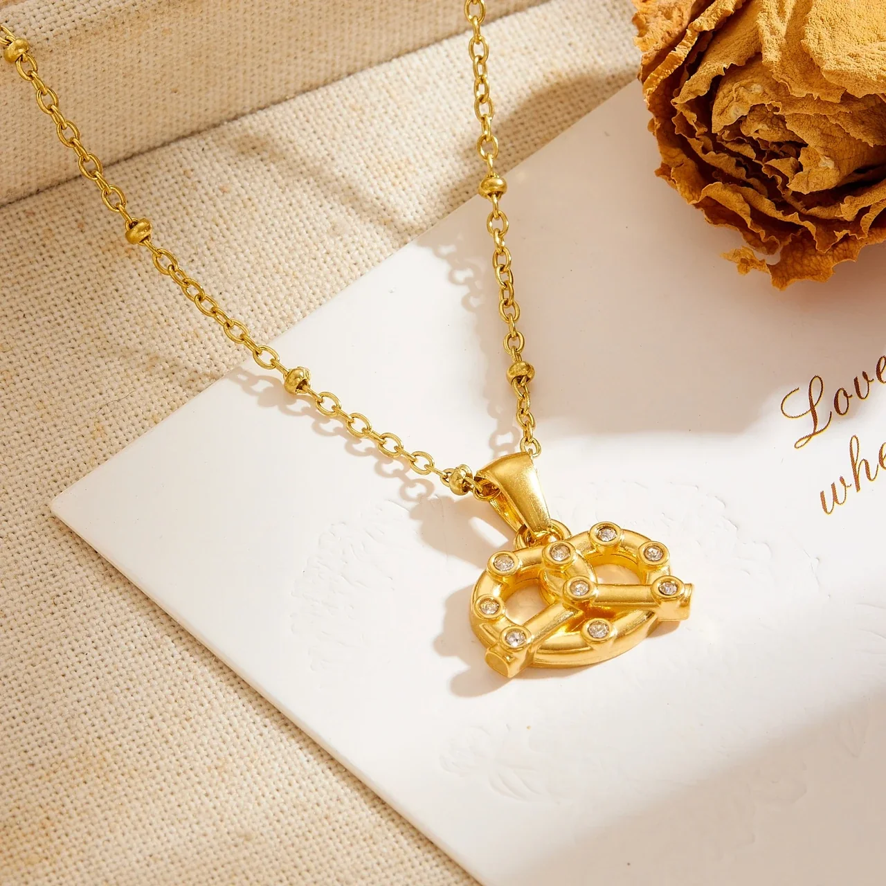 Pendant Necklace with Interwoven Crystal-Set Lines, Gold-Plated