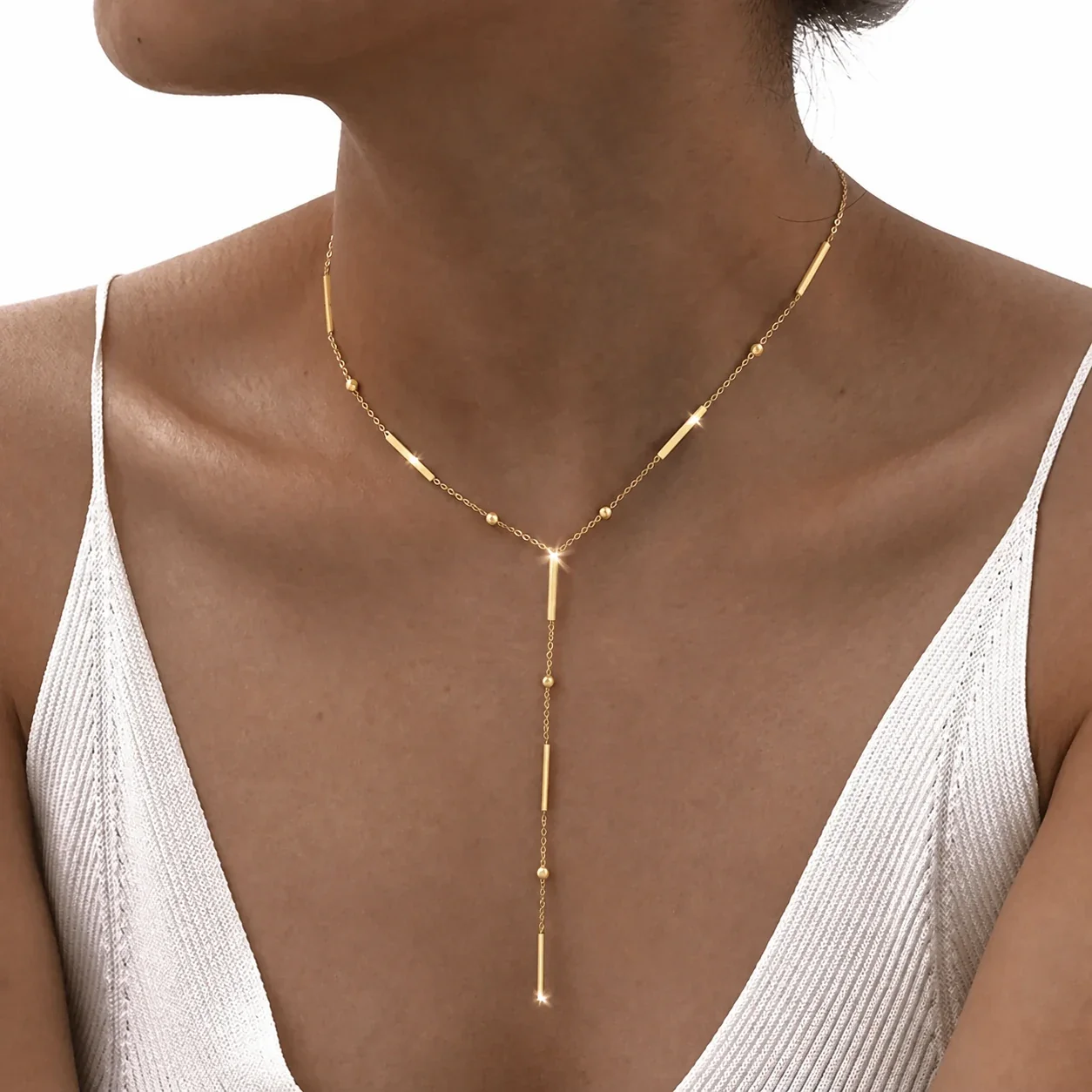 Foto prodotto: Collana uomo acciaio 316 PVD oro con barre a nappina Y