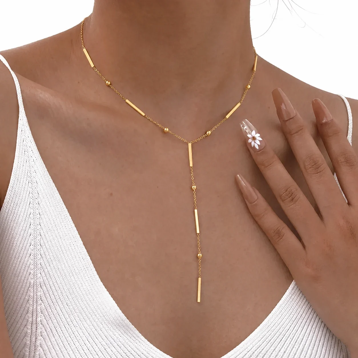 Foto prodotto: Collana uomo acciaio 316 PVD oro con barre a nappina Y