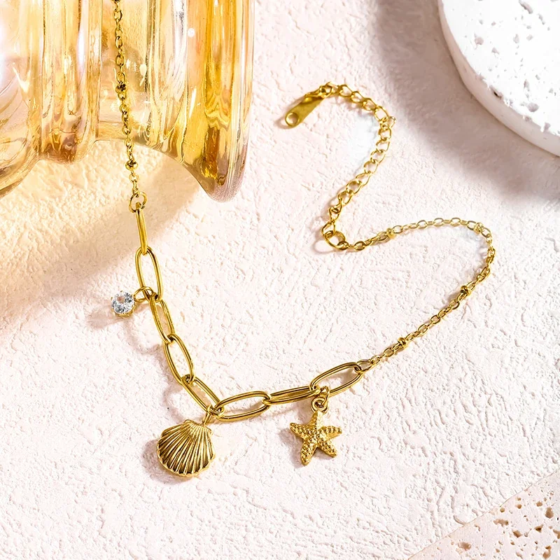 Foto del producto: Tobillera con concha acanalada, estrella de mar y cristal transparente, acero inoxidable