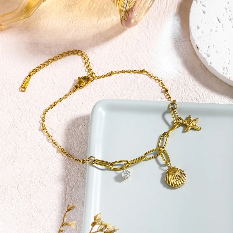 Foto del producto: Tobillera con concha acanalada, estrella de mar y cristal transparente, acero inoxidable