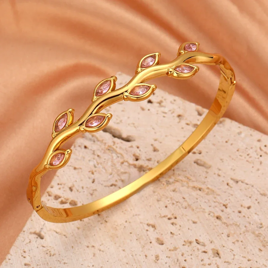 Foto prodotto: Bracciale rigido a vite con cristalli marquise colorati, acciaio placcato oro