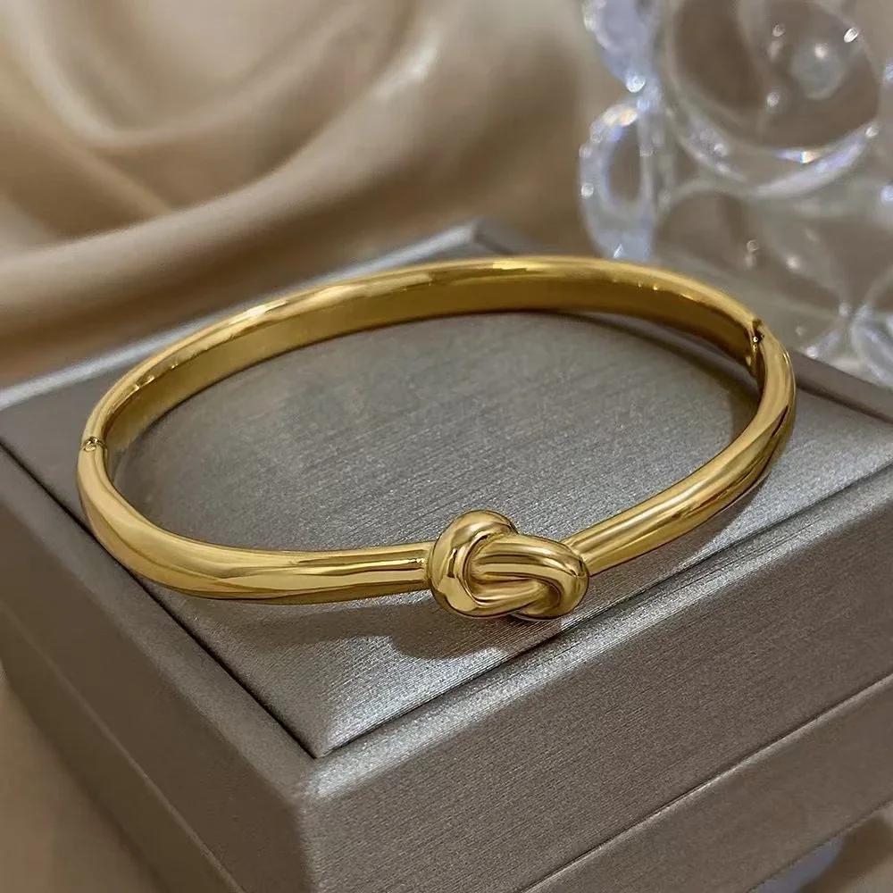 Knoopbangle met ovaal profiel van 18K verguld roestvrij staal productfoto