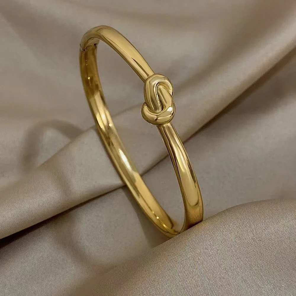 Knoopbangle met ovaal profiel van 18K verguld roestvrij staal productfoto