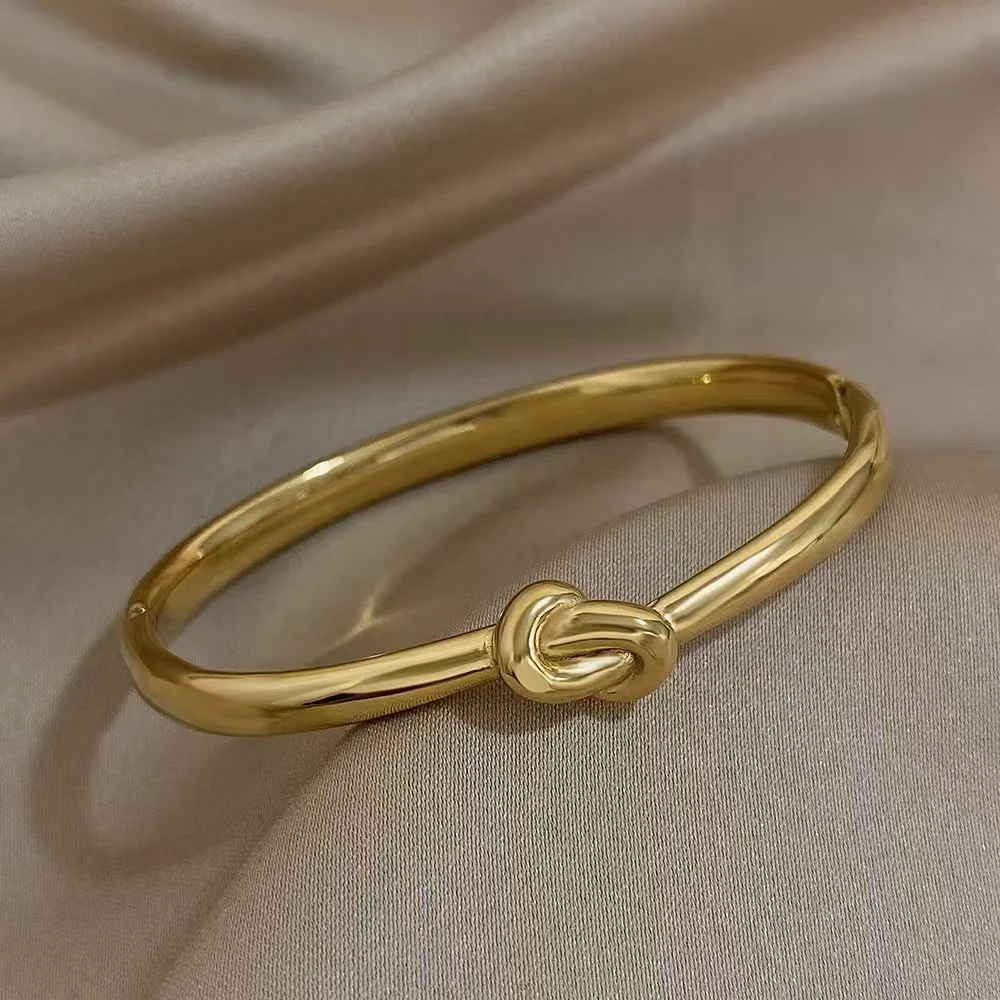 Knoopbangle met ovaal profiel van 18K verguld roestvrij staal productfoto