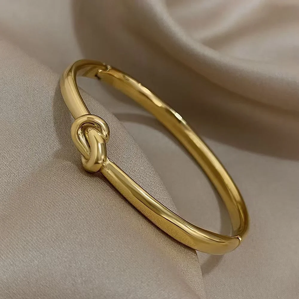 Knoopbangle met ovaal profiel van 18K verguld roestvrij staal productfoto