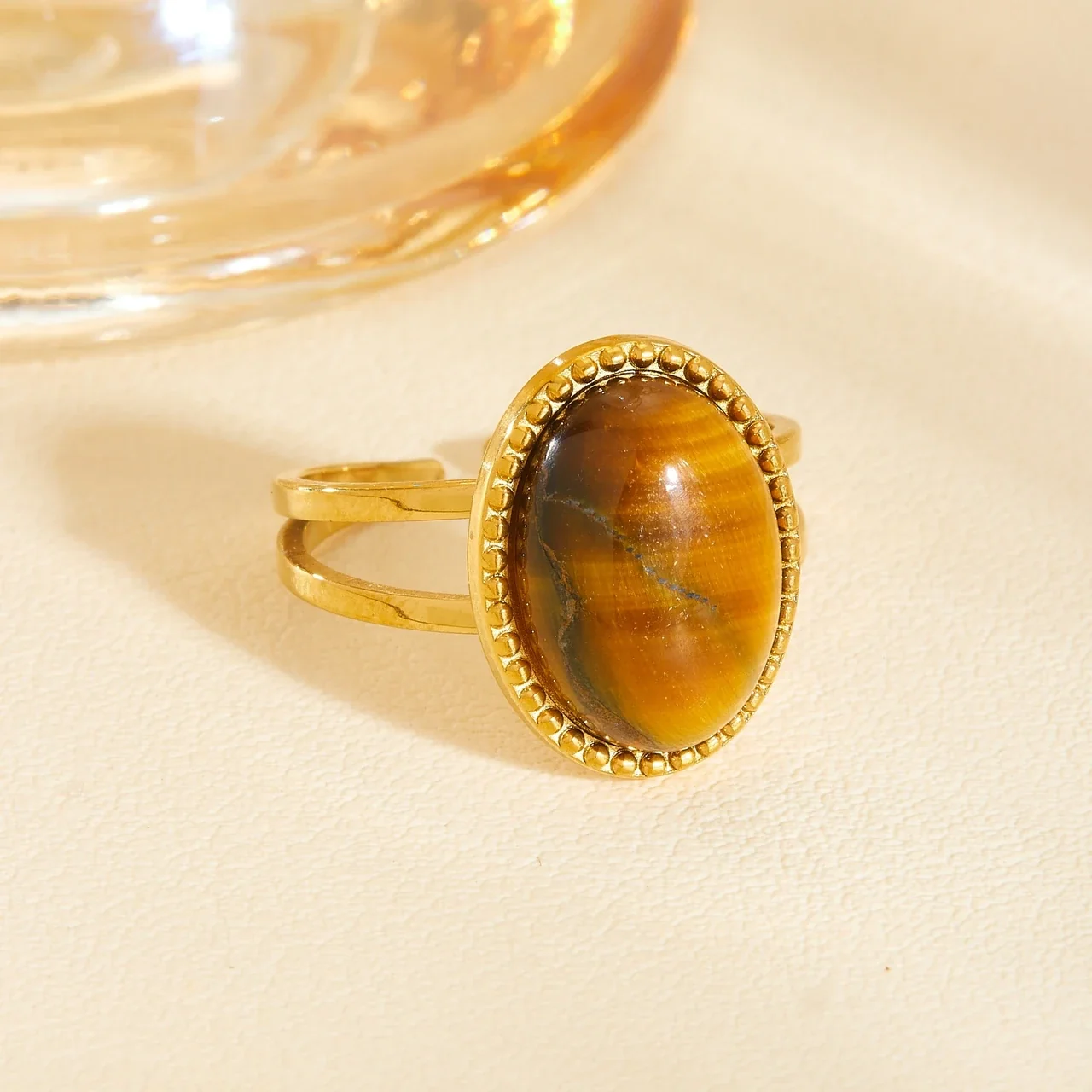 Produktfoto: Schmuckset mit ovalem Cabochon und Perlenrahmen aus vergoldetem Edelstahl