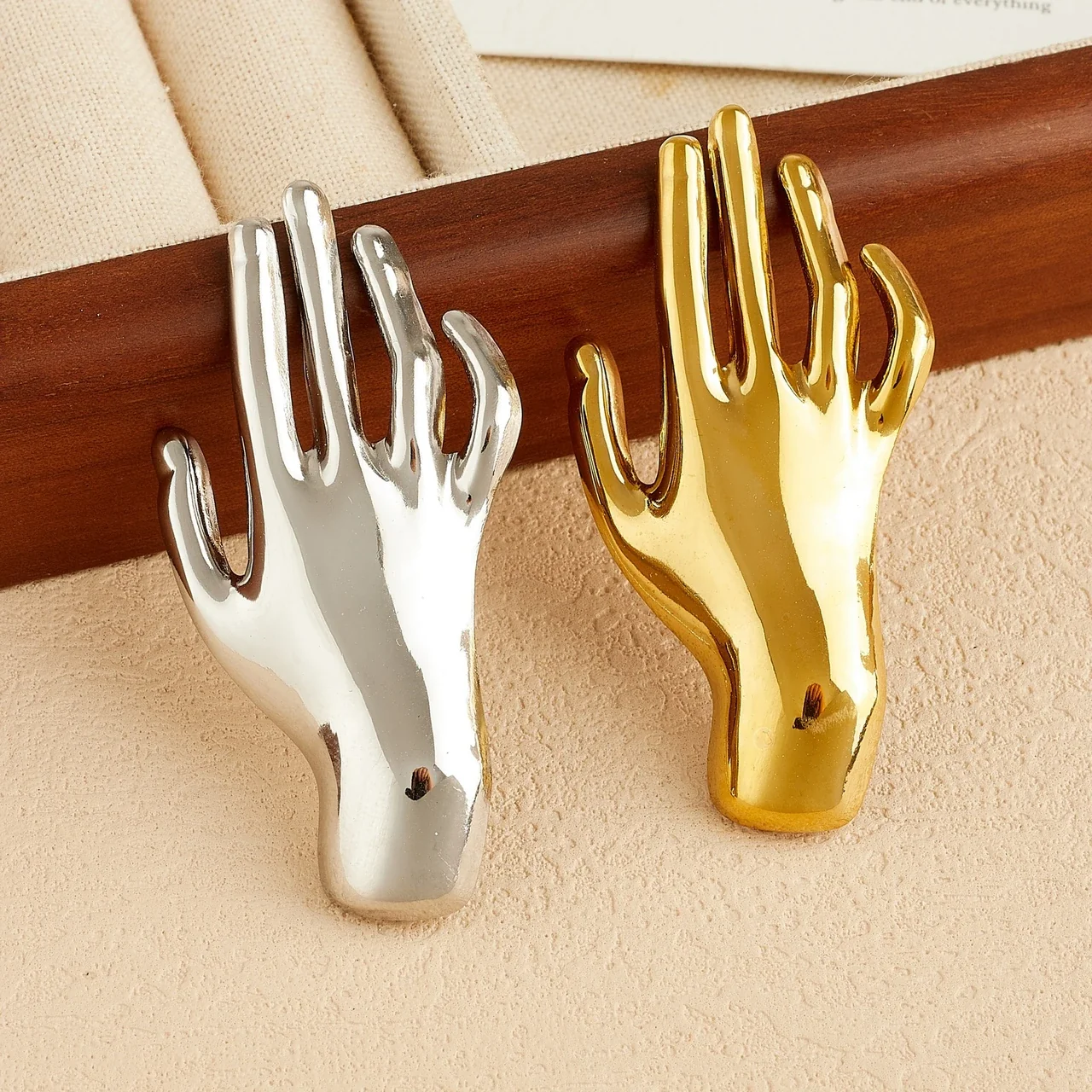 Hand Brooch with Raised Fingers in Polished Stainless Steel