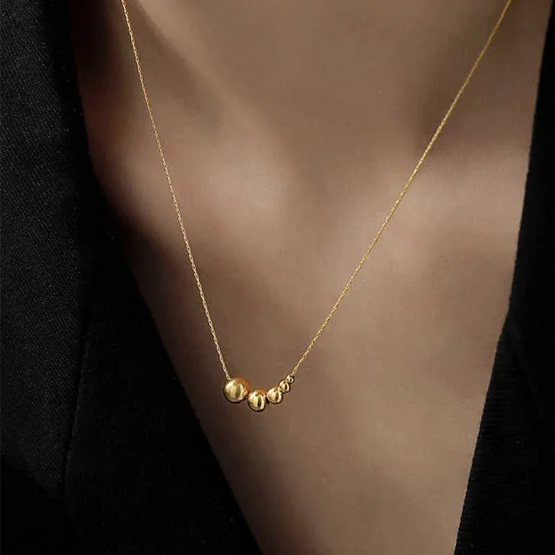 Slangenketting met vijfkralencluster van verguld roestvrij staal productfoto