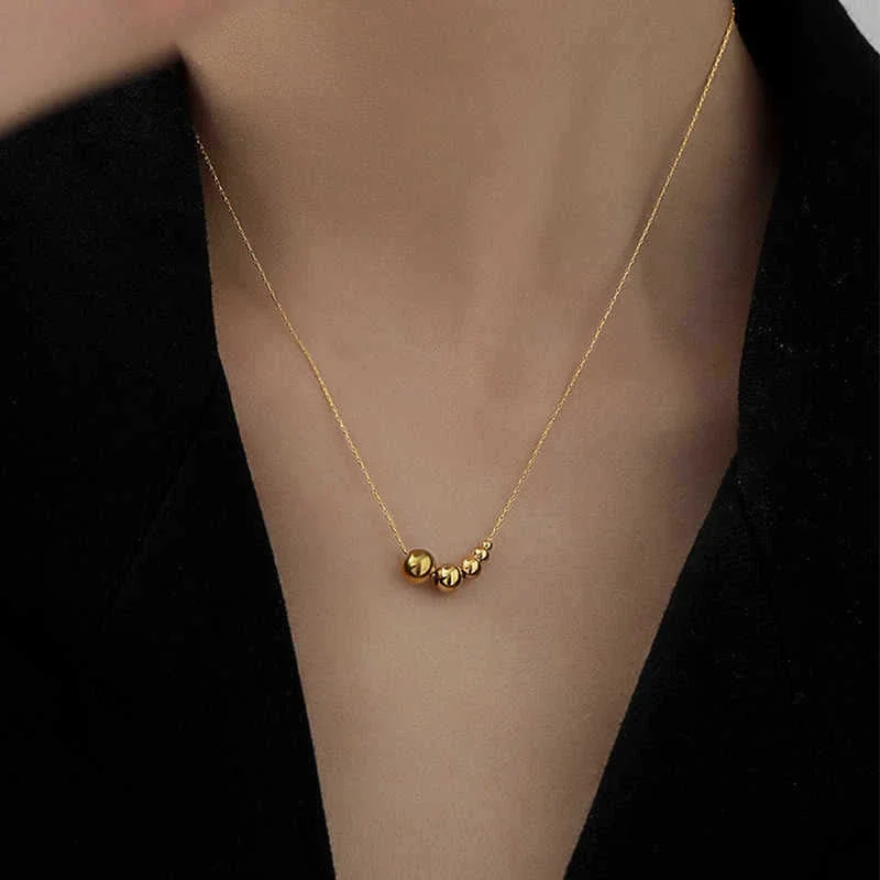 Slangenketting met vijfkralencluster van verguld roestvrij staal productfoto