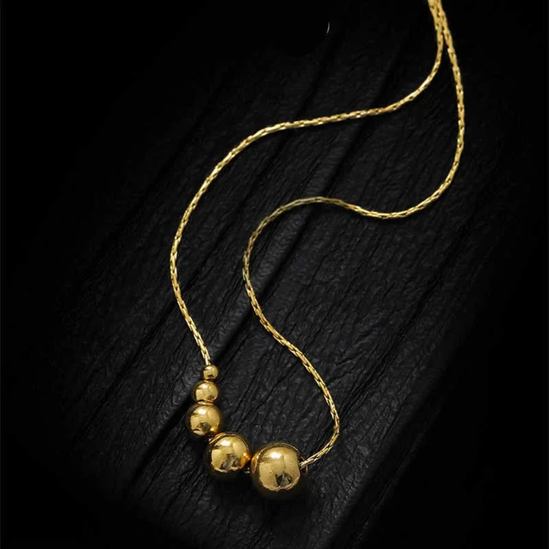 Slangenketting met vijfkralencluster van verguld roestvrij staal productfoto