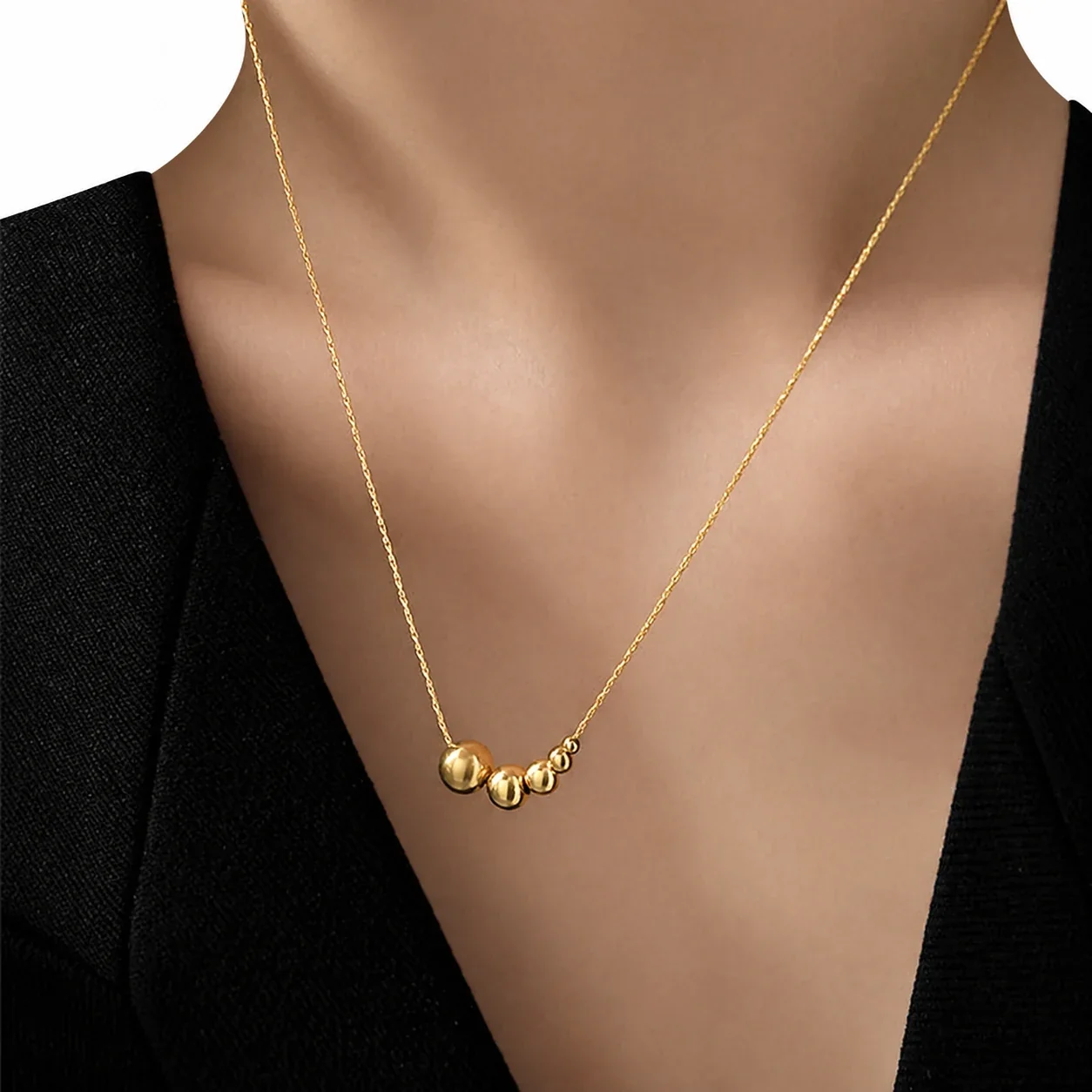 Slangenketting met vijfkralencluster van verguld roestvrij staal productfoto