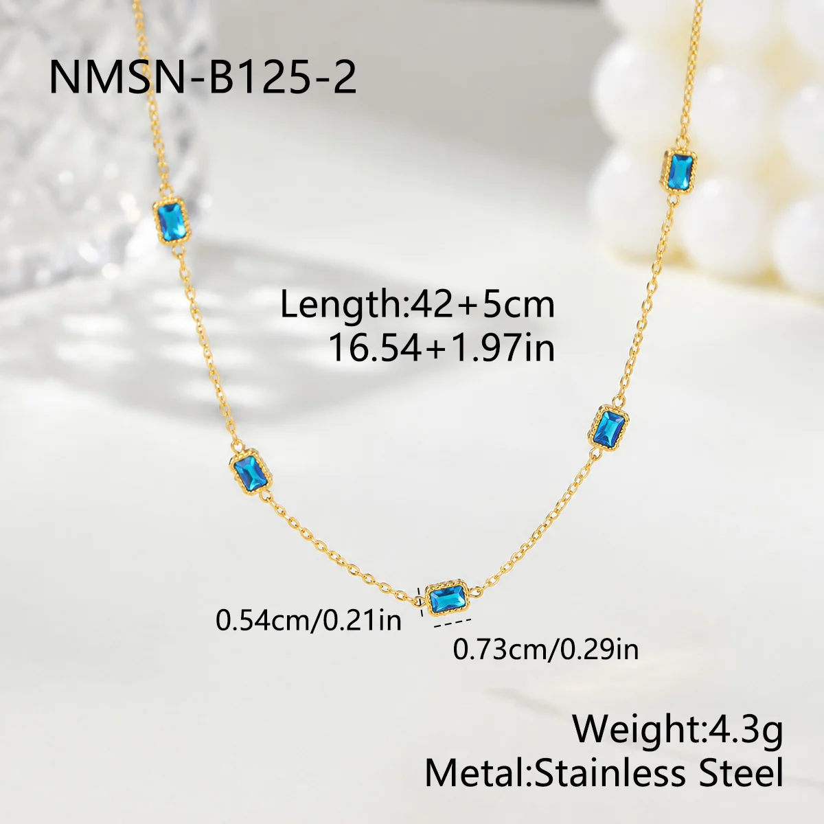 Ketting met vijf blauwe baguettekristallen in 18K verguld staal productfoto