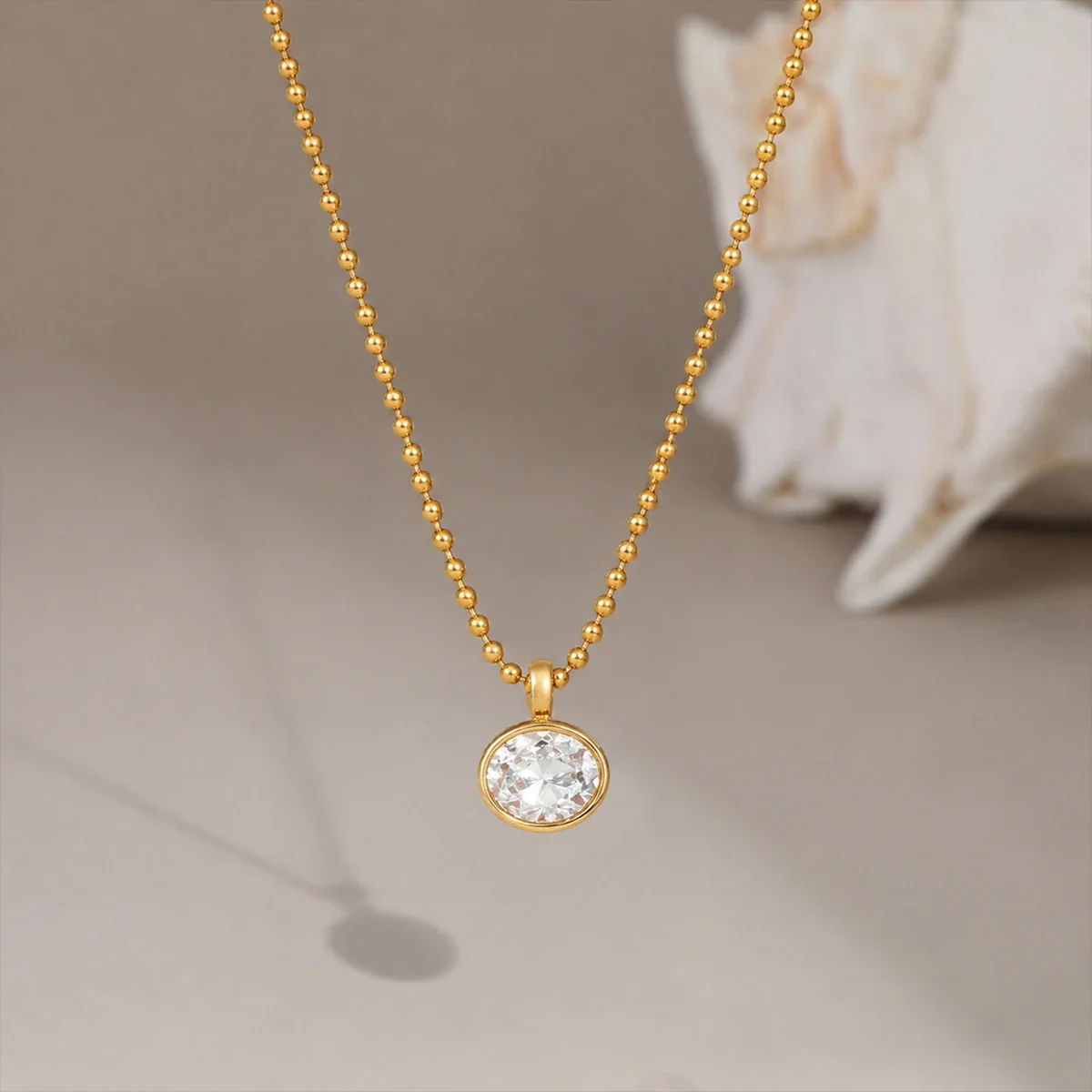 Halsketting met hanger, kralenketting en ronde CZ, verguld met 18K goud productfoto