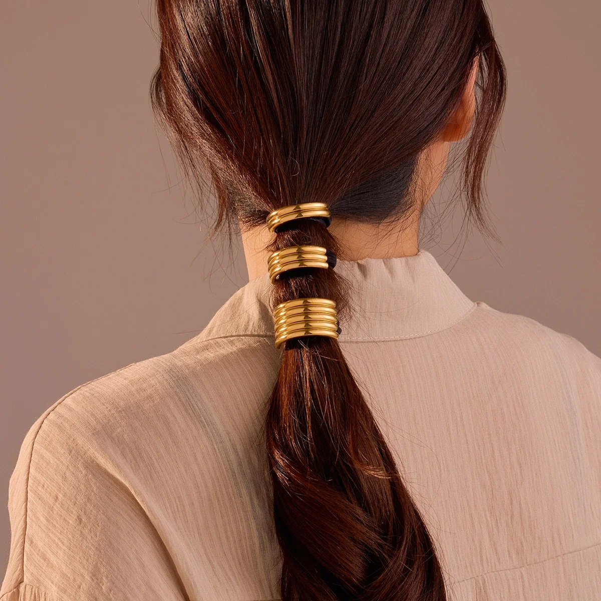 Photo produit : Élastique à cheveux en acier inoxydable plaqué or à barres courbes multiples
