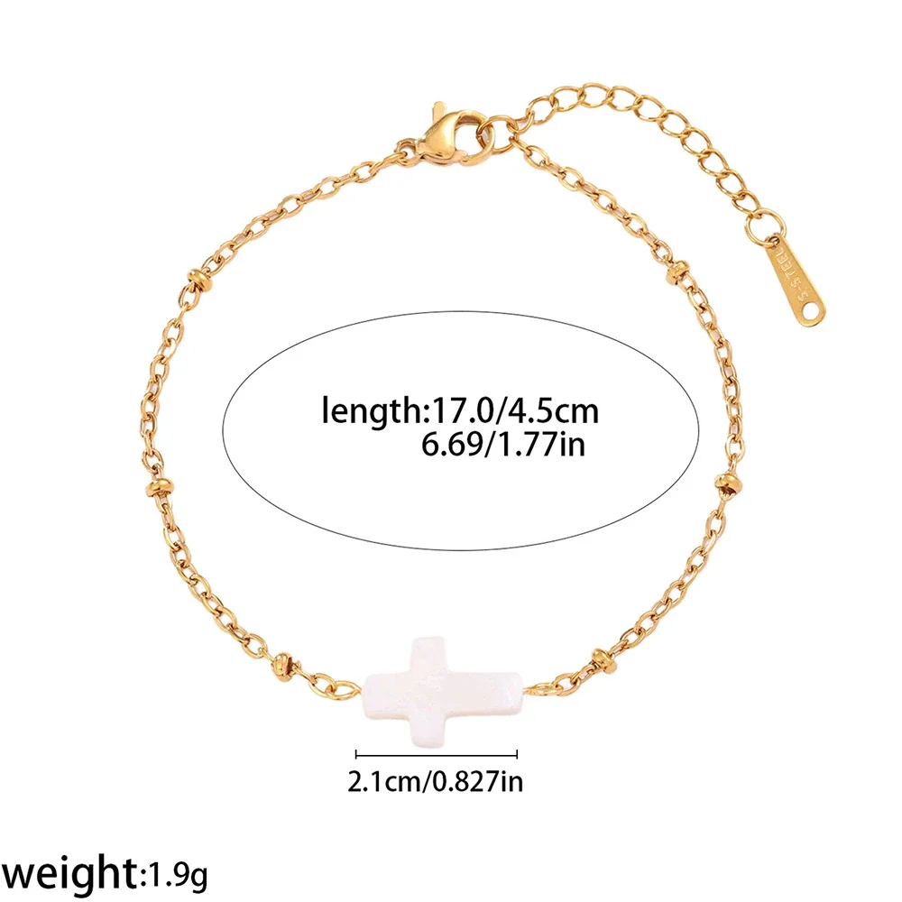 Produktfoto: Kreuz-Armband aus Naturmuschel mit Perlenakzenten, 316 Edelstahl Gold PVD