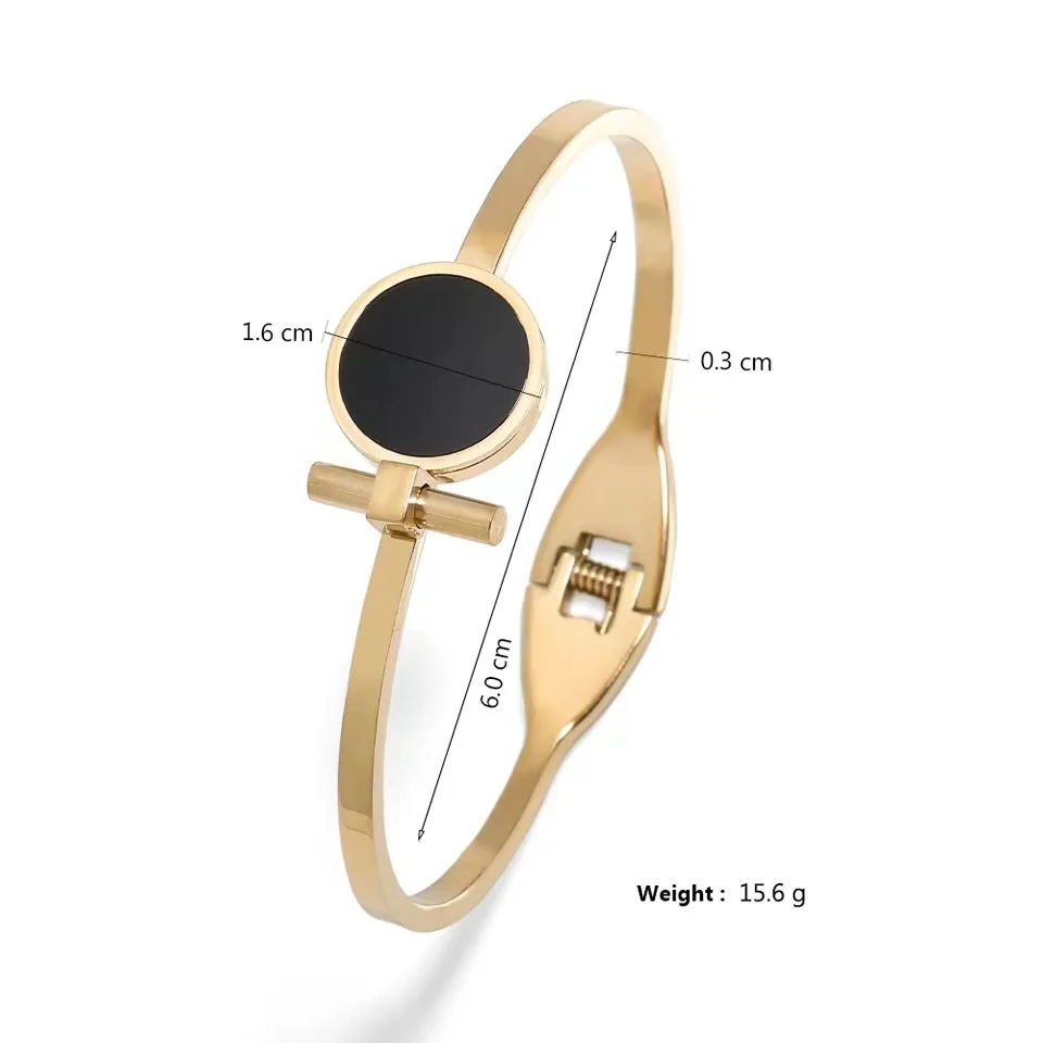 Foto del producto: Brazalete rígido con disco redondo negro y barra, acero chapado en oro