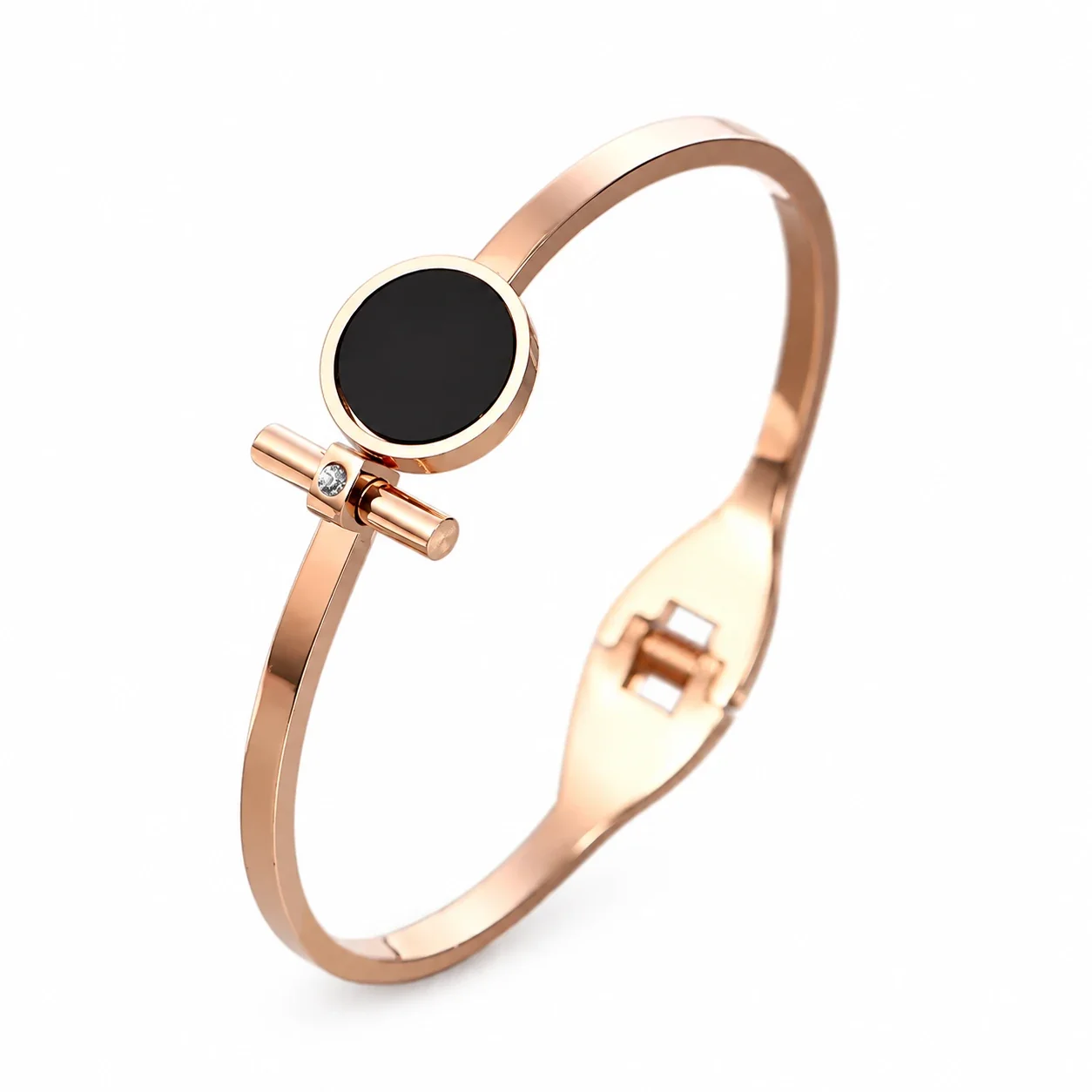 Foto del producto: Brazalete rígido con disco redondo negro y barra, acero chapado en oro