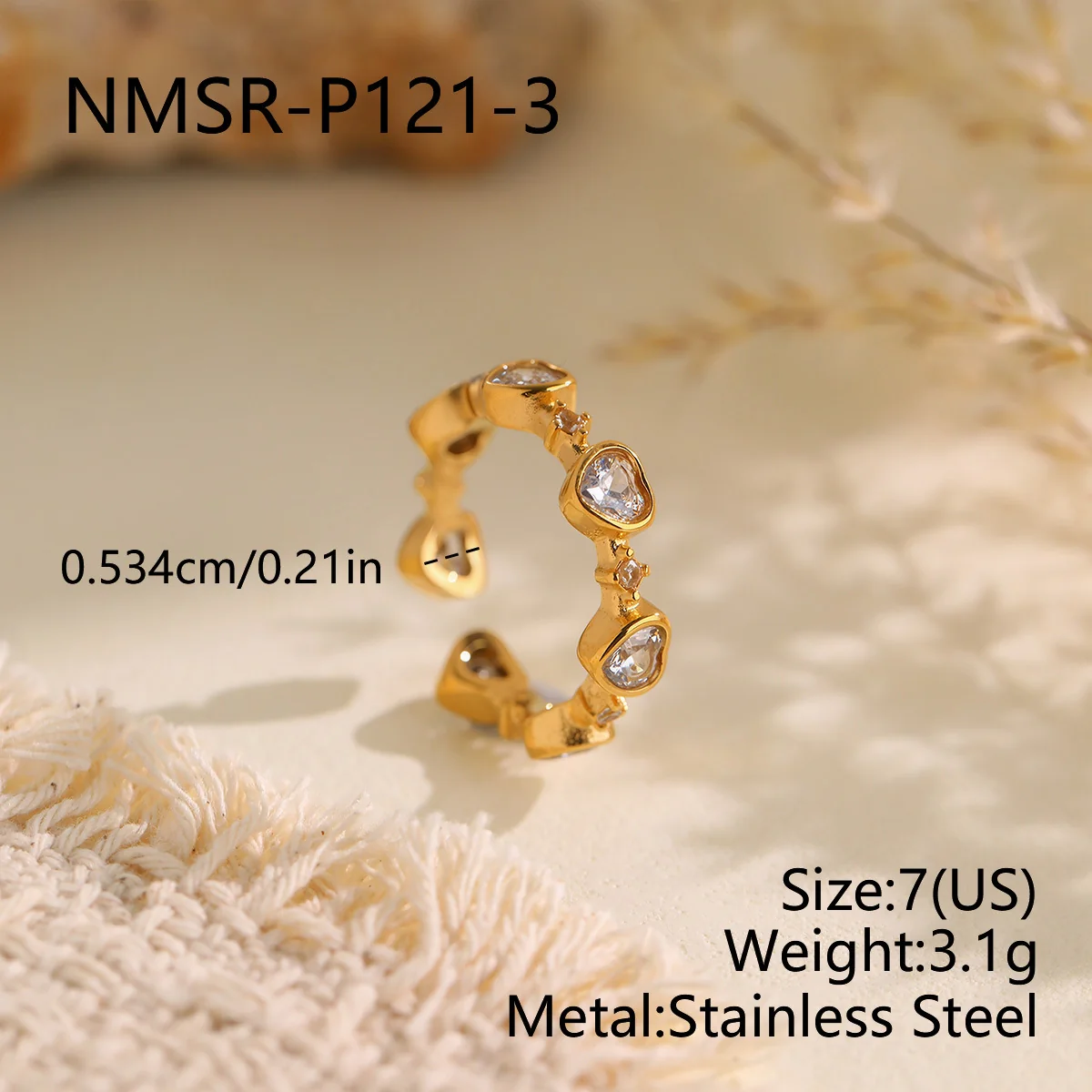 Ring met open hart-kristallen in kastzetting, verguld staal productfoto