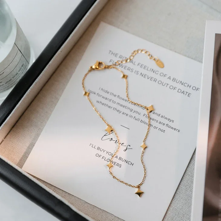 Produktfoto: Stern-Charm-Fußkette mit sieben Rautenmotiven, Edelstahl