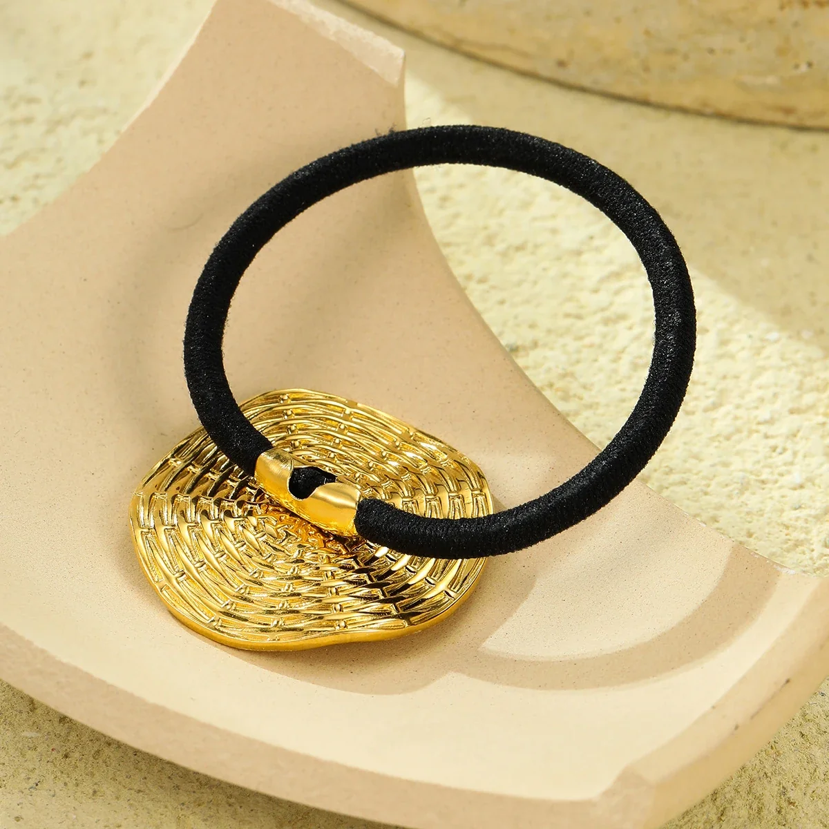 Hair Tie with Woven Round Medallion in Gold-Plated Steel