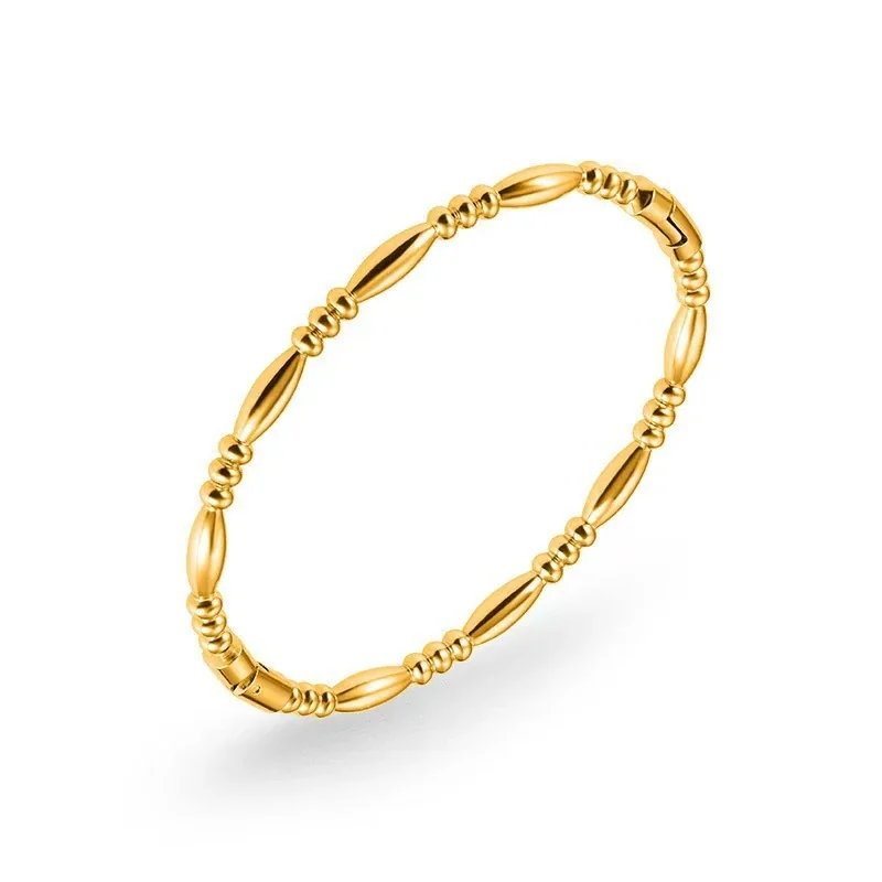 Foto del producto: Pulsera rígida de acero inoxidable 316 con cuentas oliva y PVD oro 18K