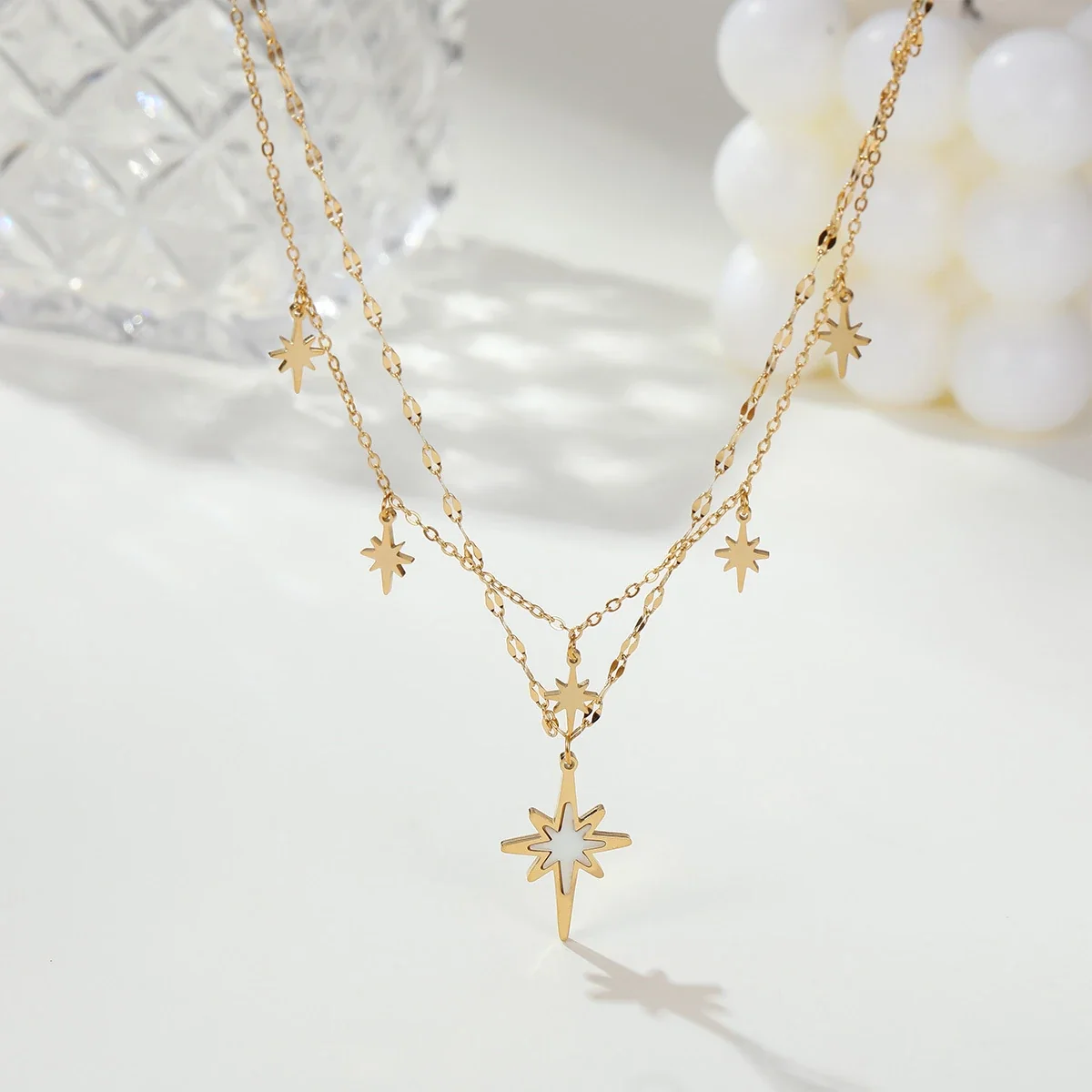 Ketting met gelaagde achtpuntige sterren, 18K verguld staal productfoto