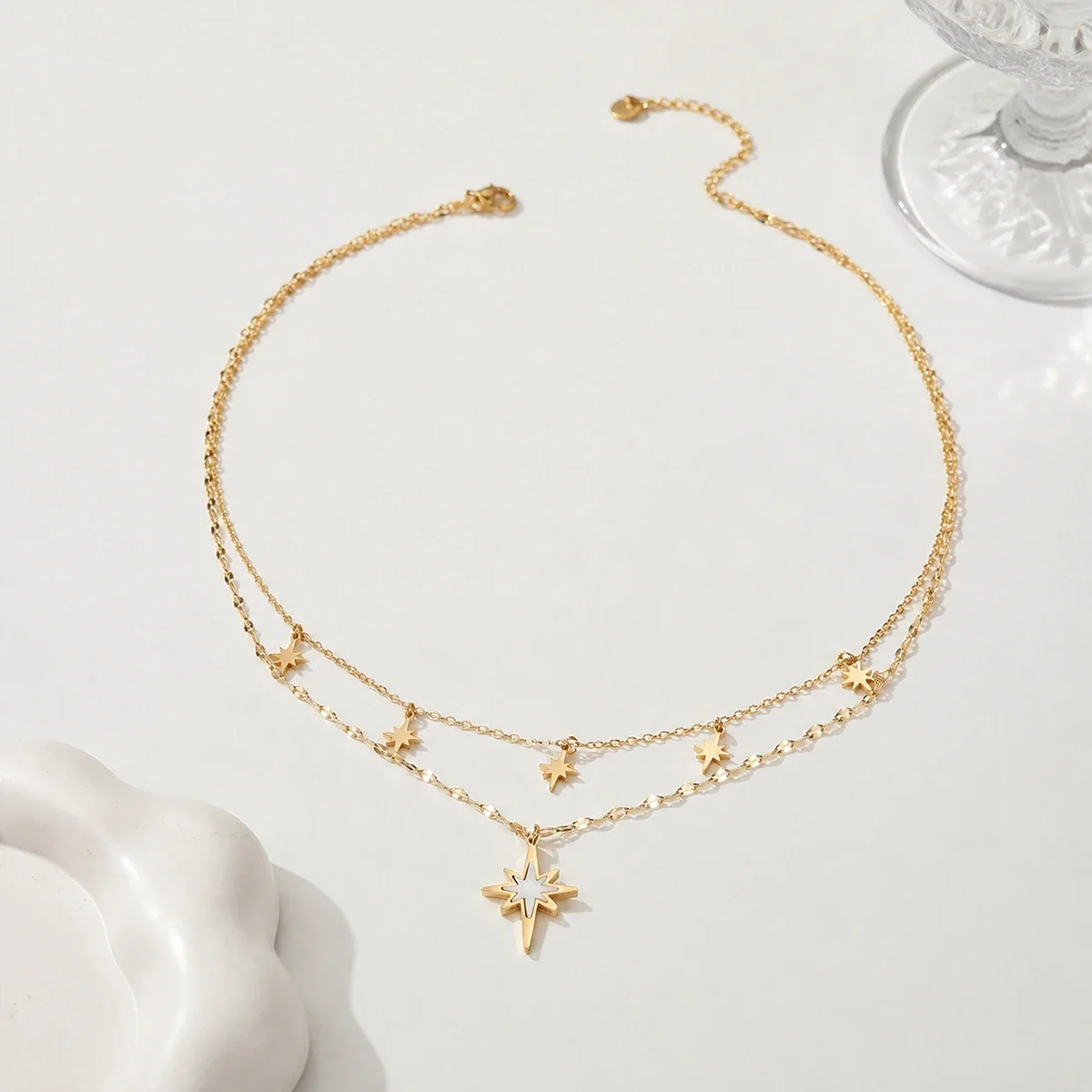 Ketting met gelaagde achtpuntige sterren, 18K verguld staal productfoto
