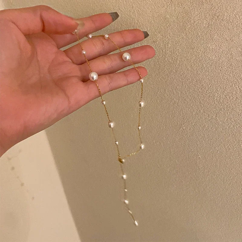 Foto del producto: Collar de acero inoxidable chapado en oro con cadena O y caída en Y de perlas