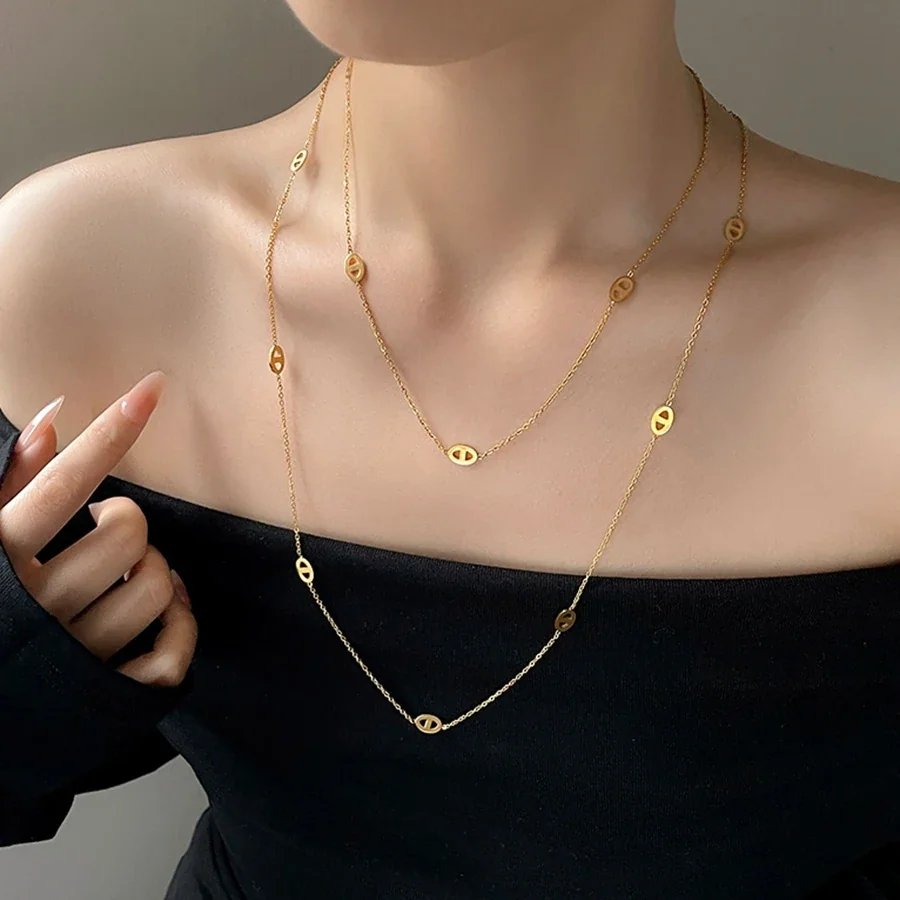 Gelaagde ketting met ovale openwerkmotieven, verguld productfoto