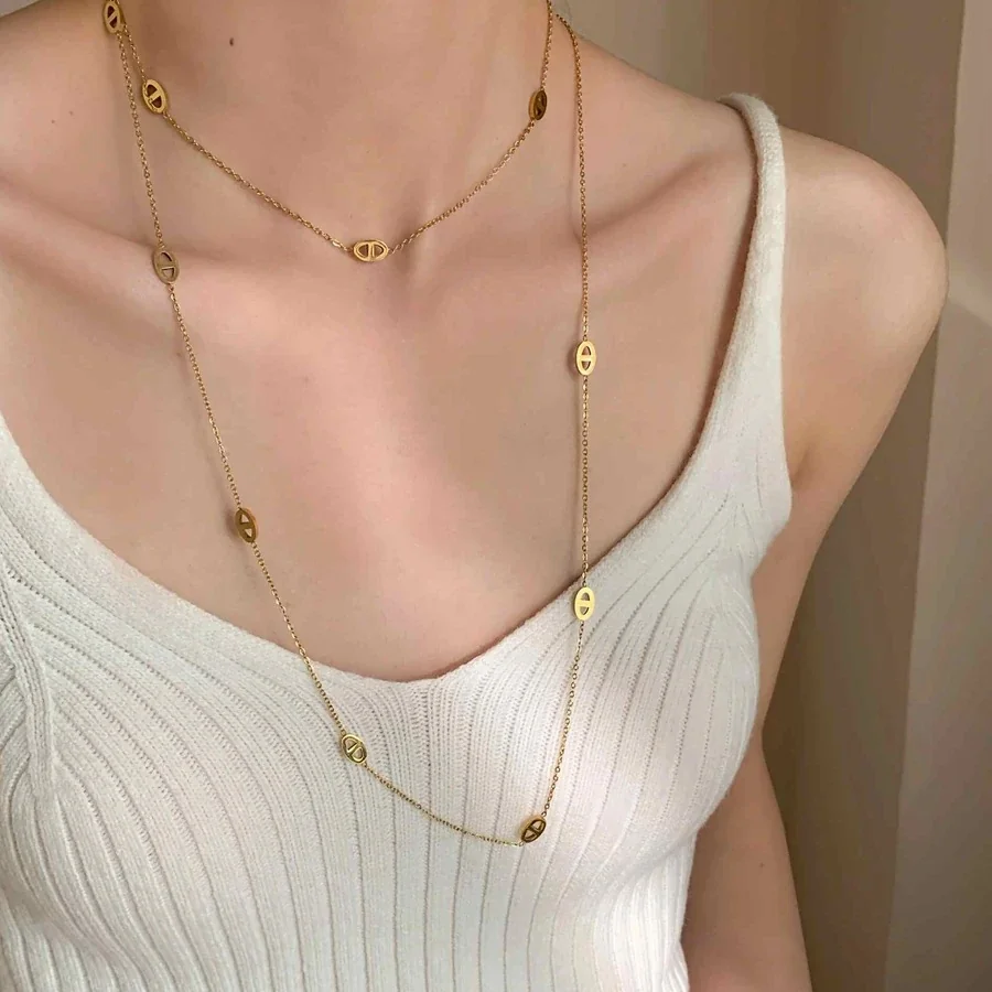 Gelaagde ketting met ovale openwerkmotieven, verguld productfoto