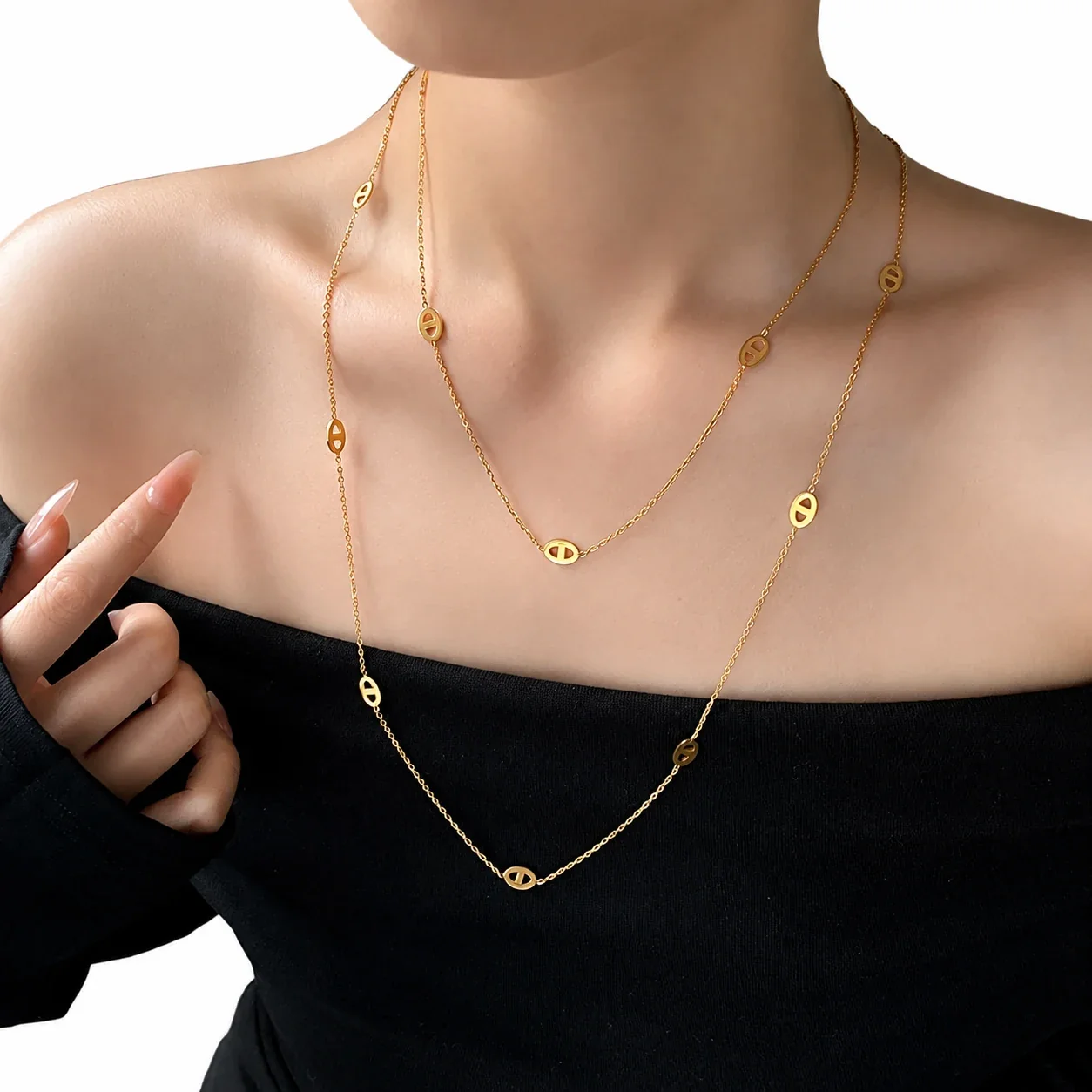 Gelaagde ketting met ovale openwerkmotieven, verguld productfoto