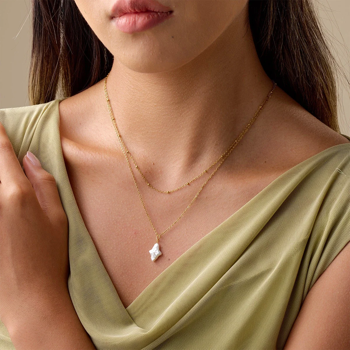 Gelaagde ketting met sterparel en 18K-vergulding productfoto