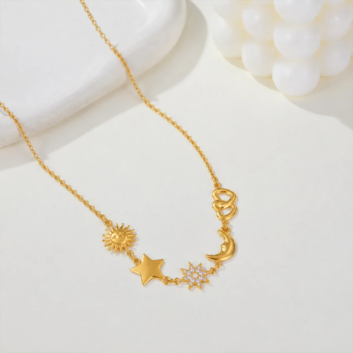 Ketting met zon-, ster- en maanmotieven in 18K verguld staal productfoto