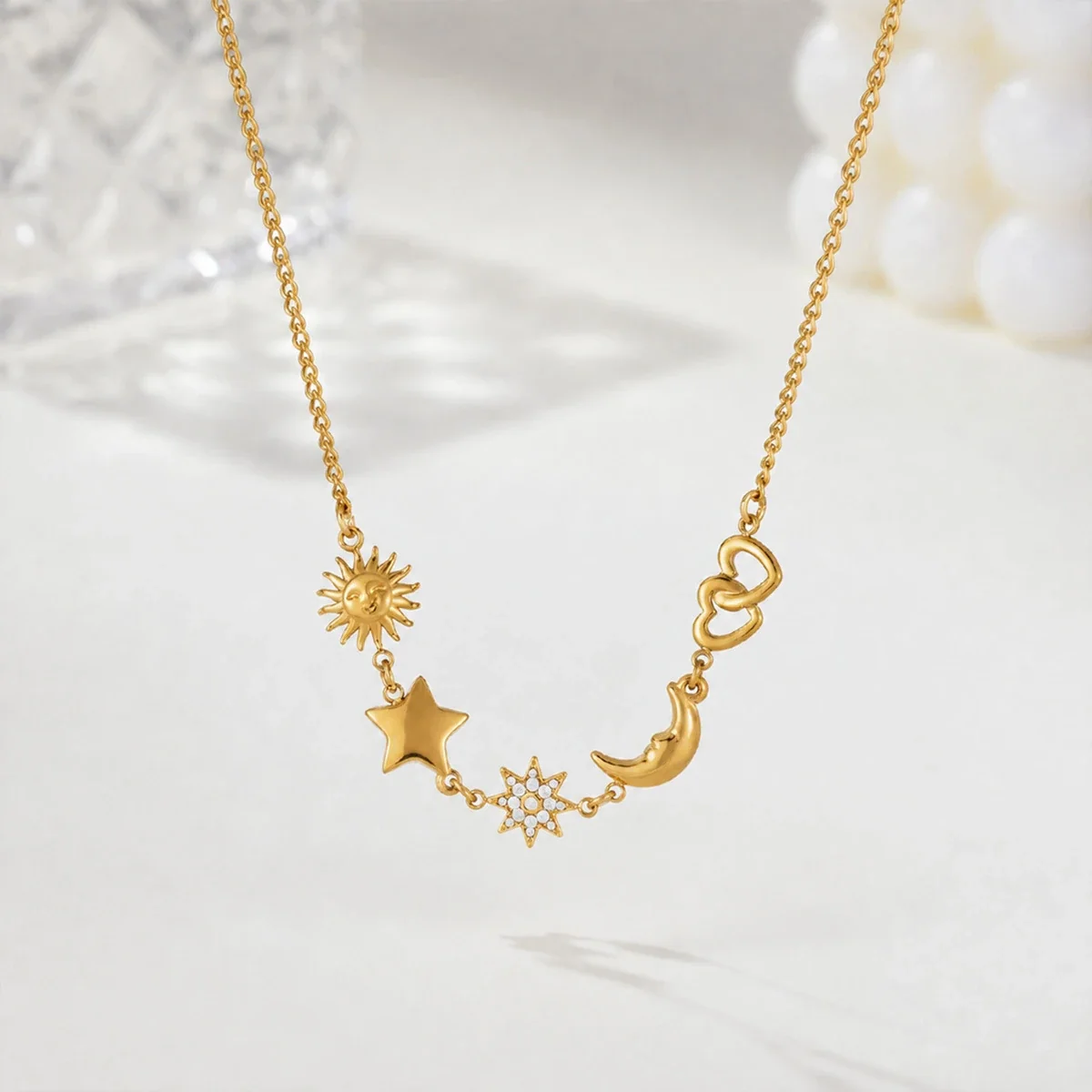 Ketting met zon-, ster- en maanmotieven in 18K verguld staal productfoto