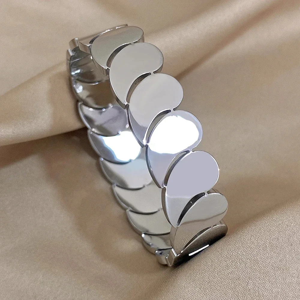 Bangle met overlappende druppelvormige schakels, verguld roestvrij staal productfoto