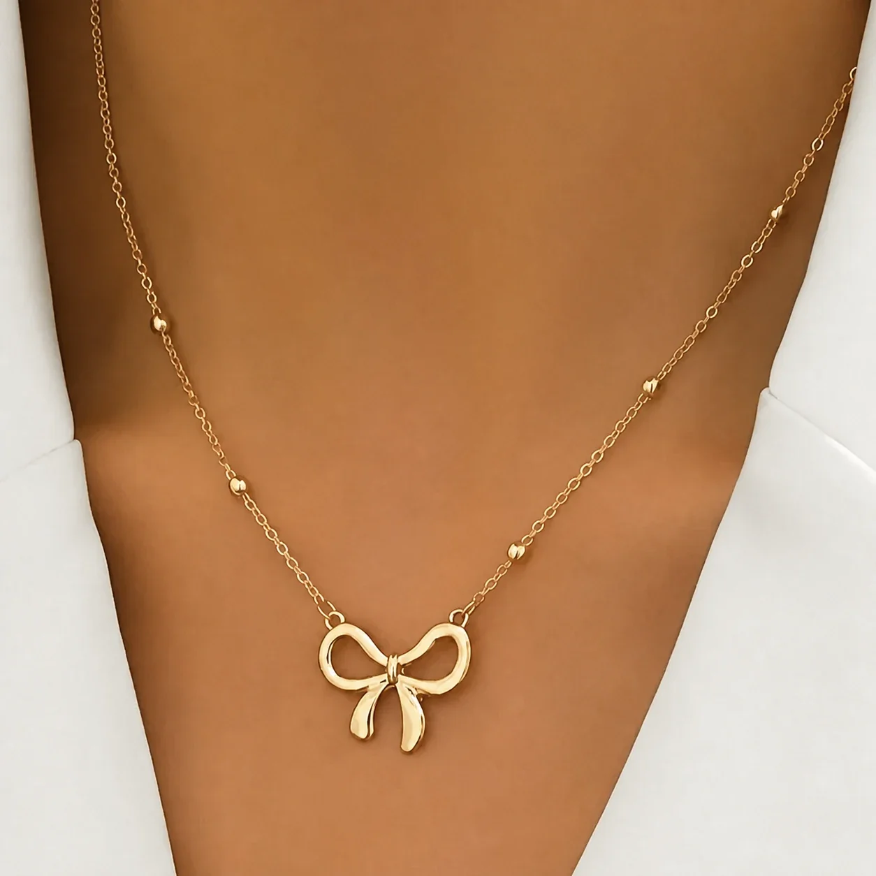 Produktfoto: Schleifenanhänger-Perlenkette aus 316 Edelstahl mit Gold PVD