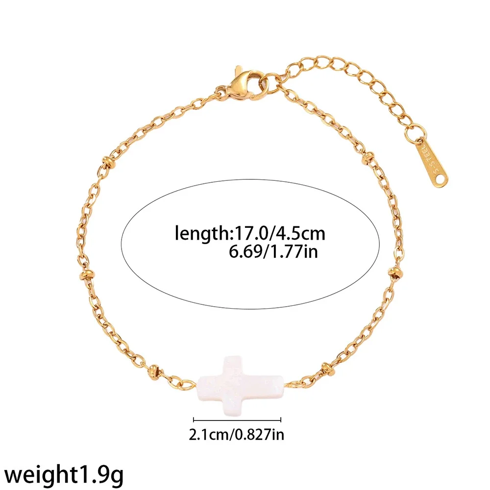 Photo produit : Bracelet croix plaqué or avec incrustation blanche, acier inoxydable 316