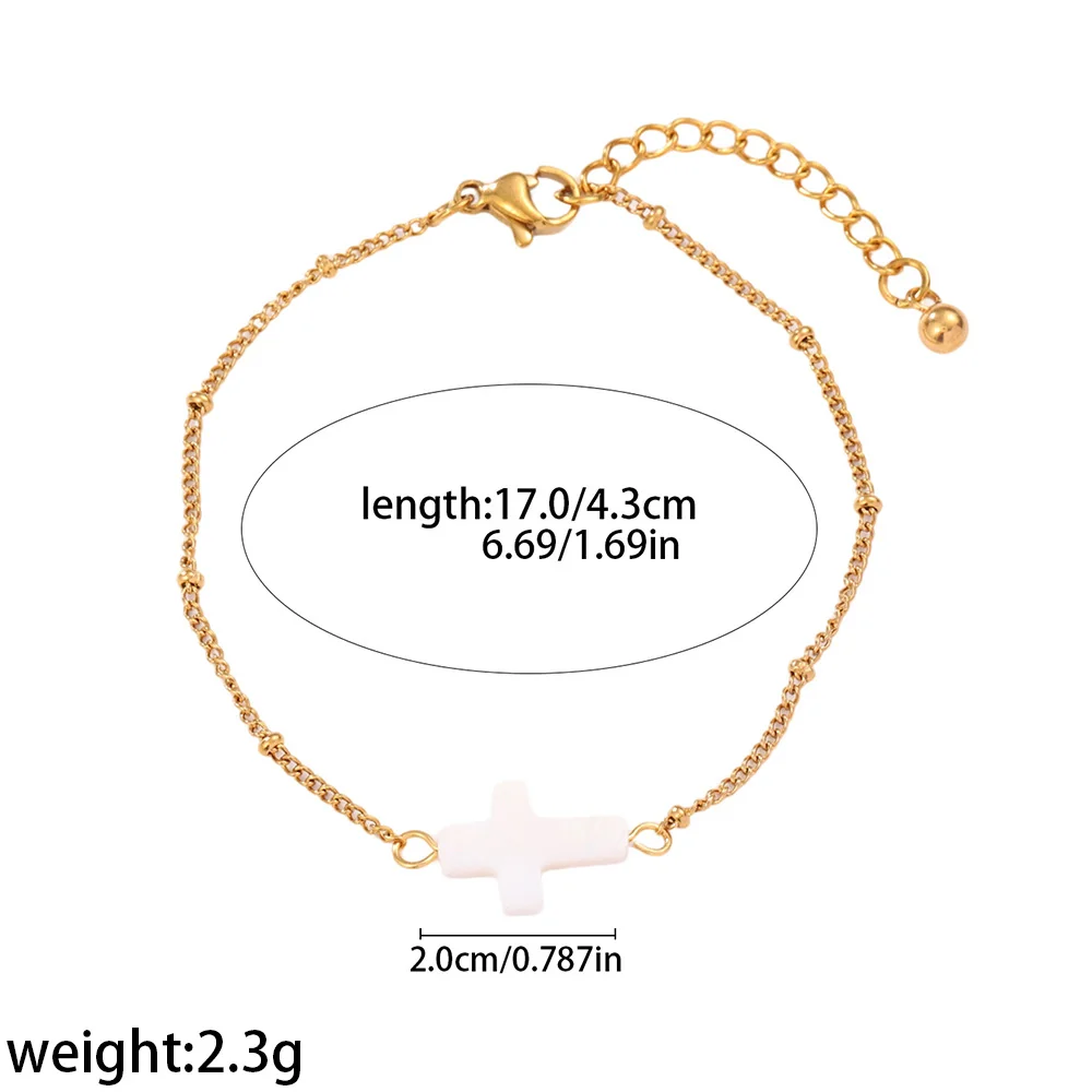 Photo produit : Bracelet croix plaqué or avec incrustation blanche, acier inoxydable 316