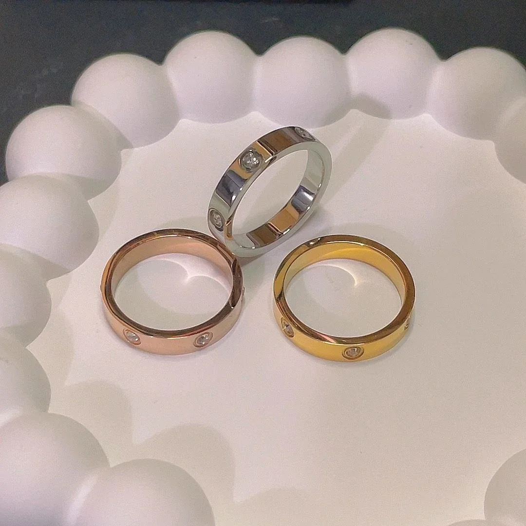 Ring: Six Cubic Zirconia Bezel-Set Flat Band Stainless Steel