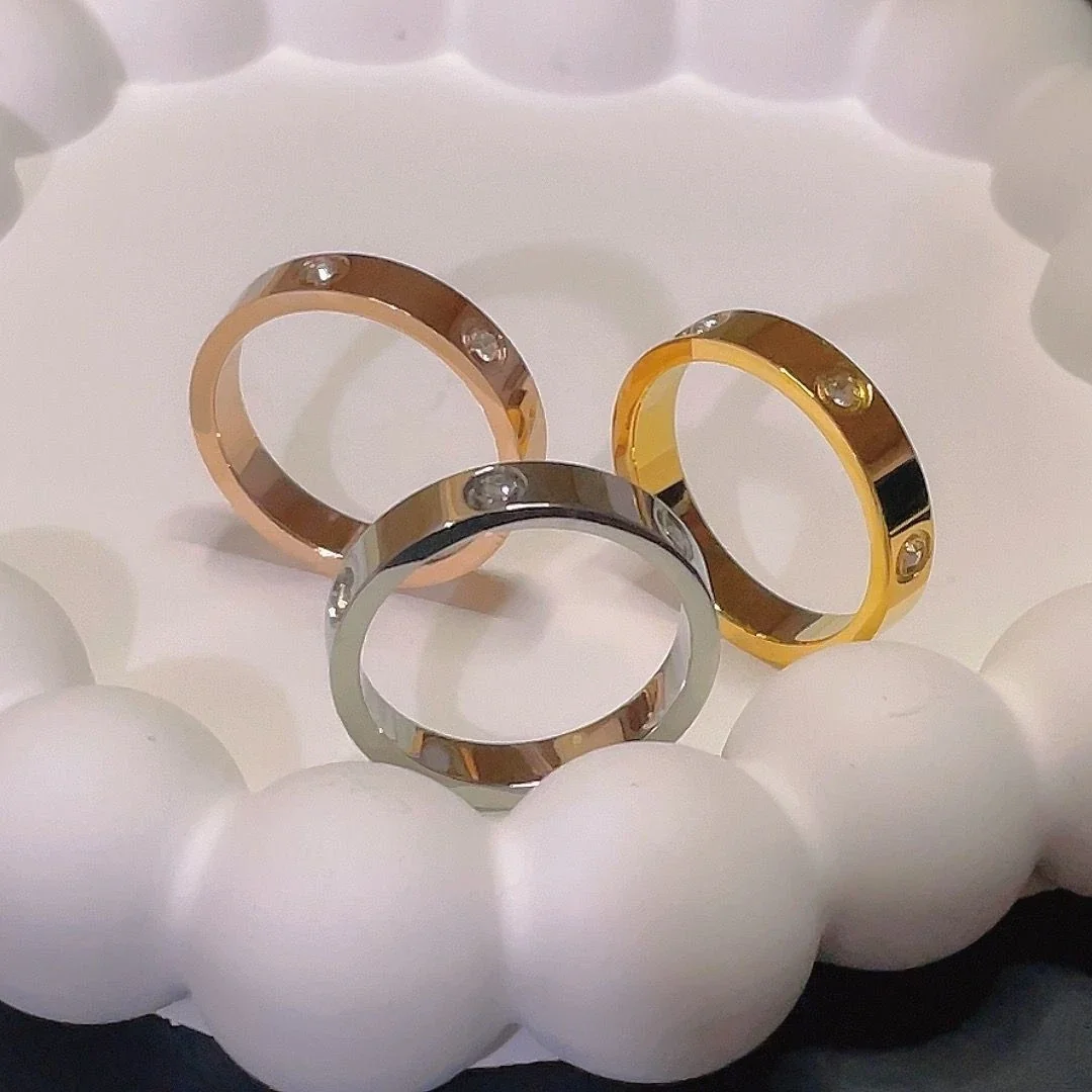 Ring: Six Cubic Zirconia Bezel-Set Flat Band Stainless Steel