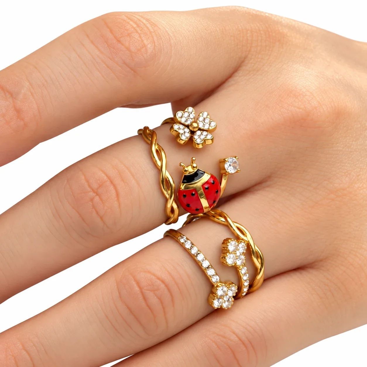 Ringen van roestvrij staal met lieveheersbeestje, bloemen en gedraaide banden productfoto