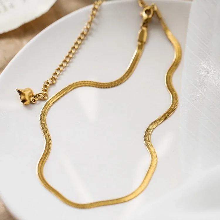 Slangenketting met hartvormig verlengstuk, verguld roestvrij staal productfoto